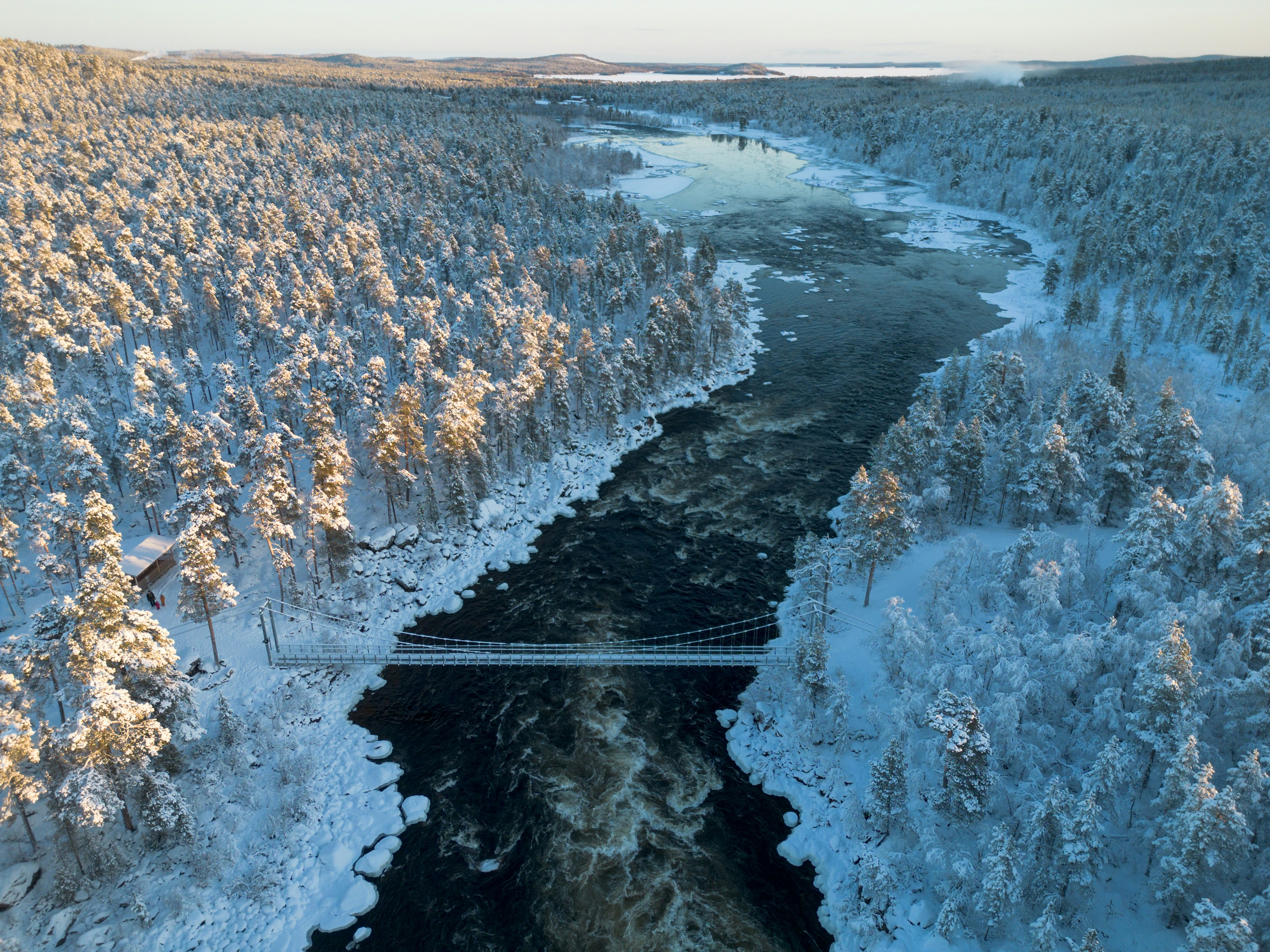 Snowy river landscape near Inari in winter