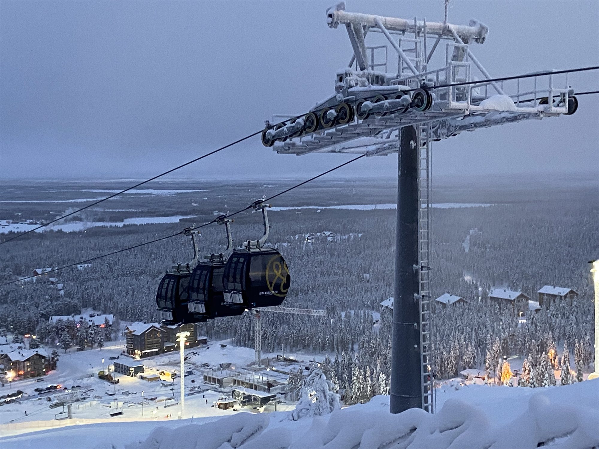 Gondola above the snowy Levi fell with Sirkka below.