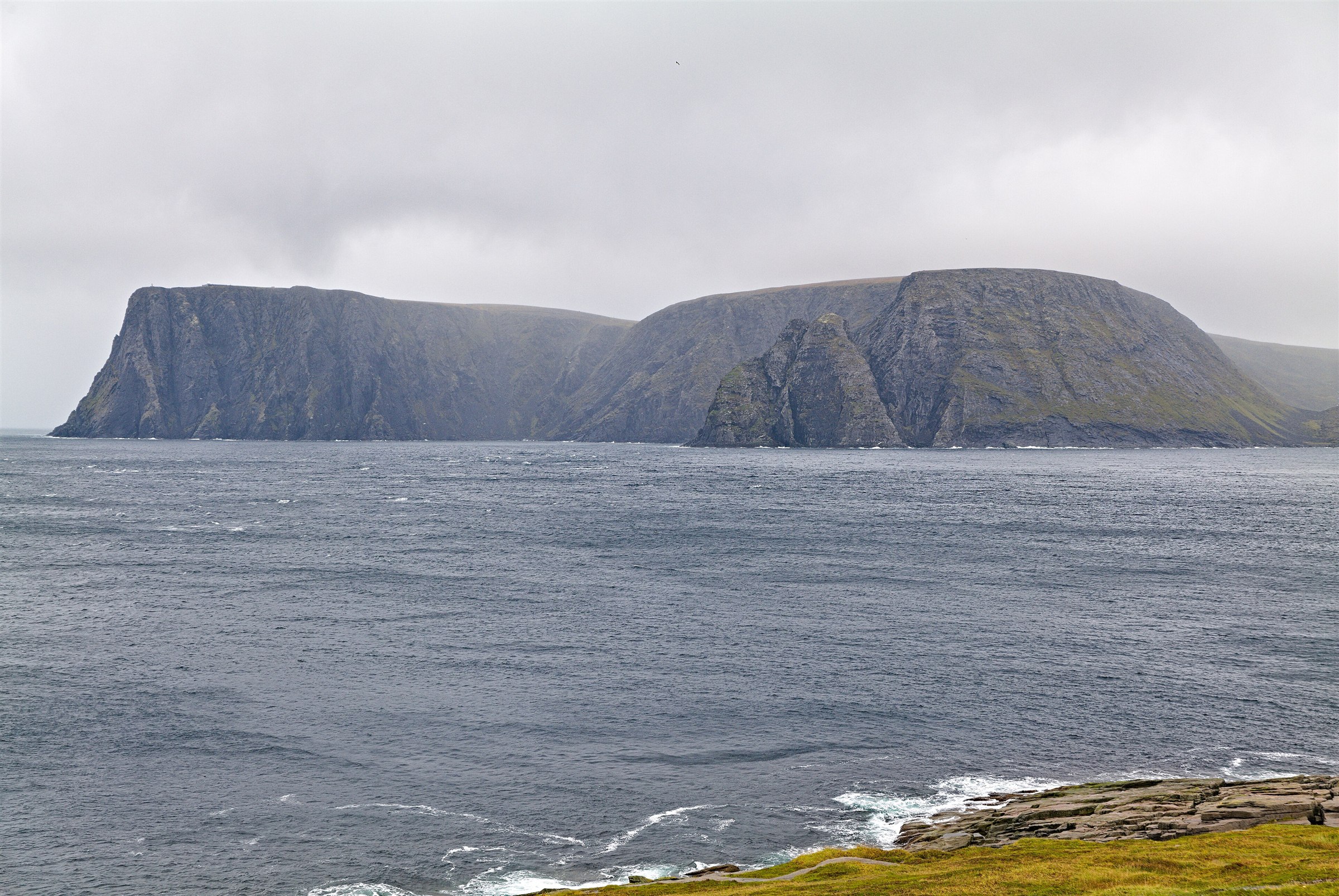 The Nordkapp cliffs seen across the Arctic Ocean on the approach to Magerøya.