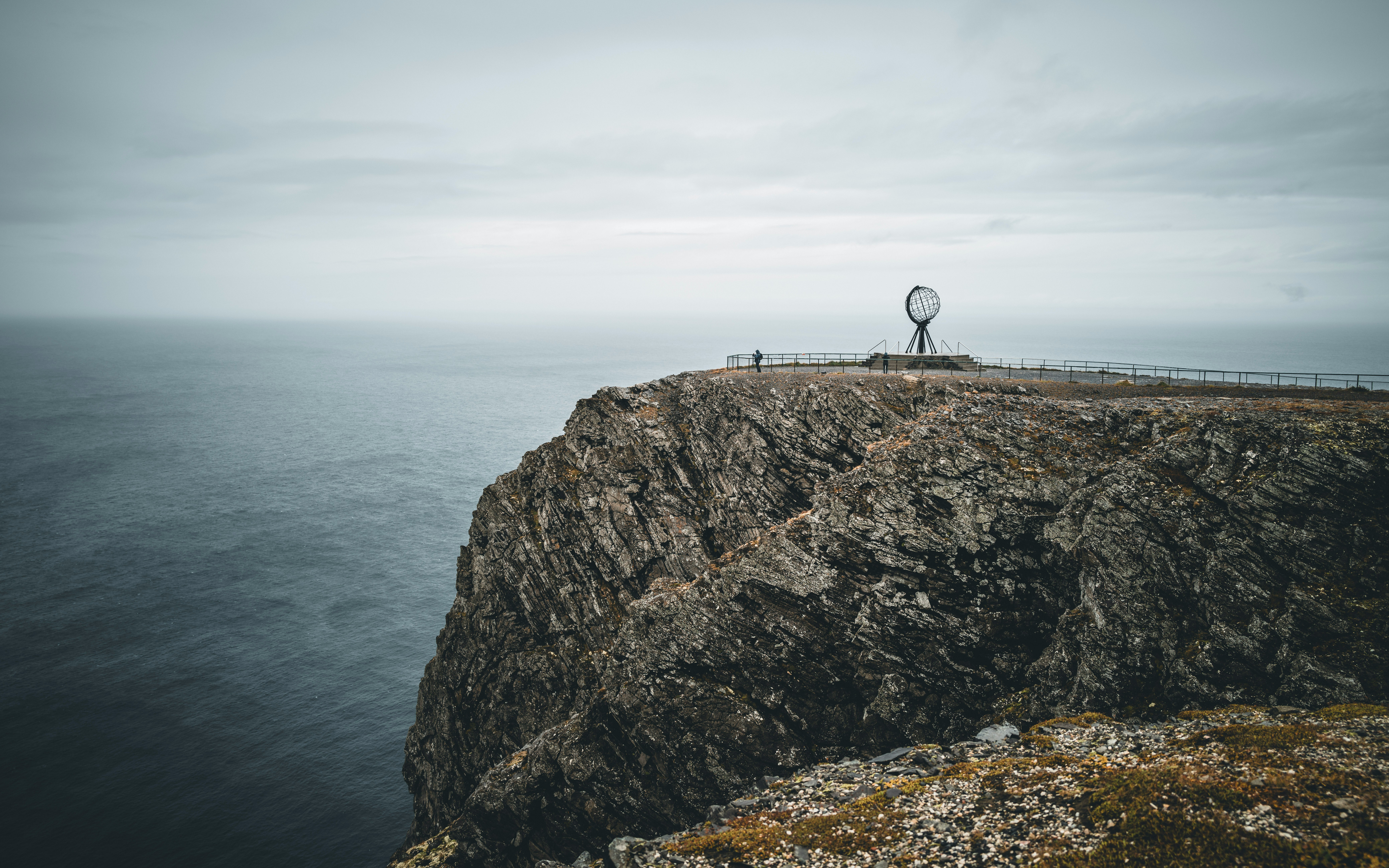 The Nordkapp cliff and Globe monument above the Arctic Ocean.