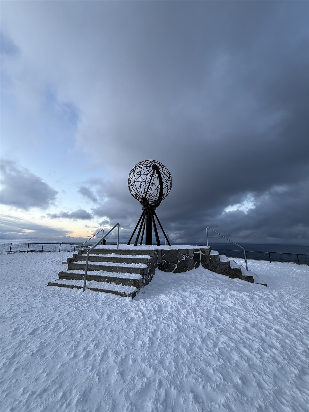 The Globe monument at Nordkapp under a winter sky.